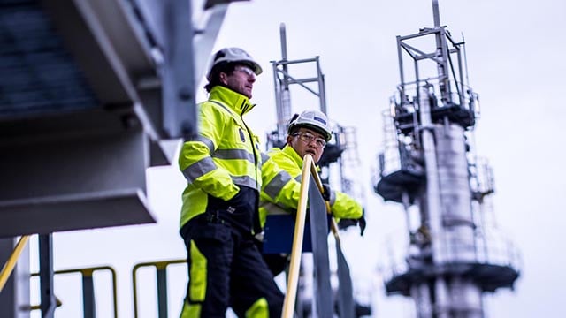 oil refinery workers discussing outside.jpg